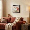 Autumn Pumpkin Framed Wall Art Piece displayed in a cozy living room setting with a sofa and decorative elements.