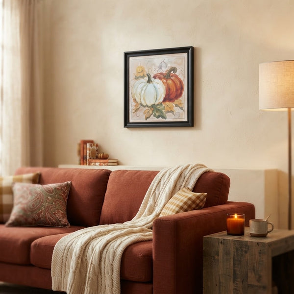 Autumn Pumpkin Framed Wall Art Piece displayed in a cozy living room setting with a sofa and decorative elements.