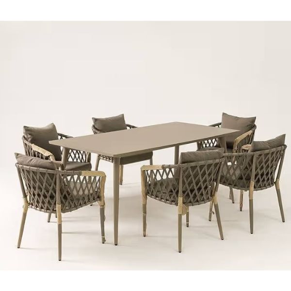 Luxury 6-Seater Outdoor Patio Dining Set featuring a modern ceramic table and stylish woven chairs.