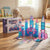 58-Piece Diamond Magnetic Building Tiles set displayed with colorful structures on a wooden floor.