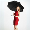 Model showcasing a Curved Handle Automatic Rain Umbrella while wearing a red dress.