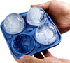 Sports Ice Ball Molds in hand, featuring soccer-shaped ice balls ready for drinks.