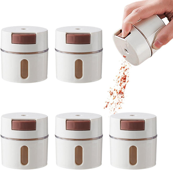 Magnetic Stainless Steel Spice Storage Box with spice being poured from container.