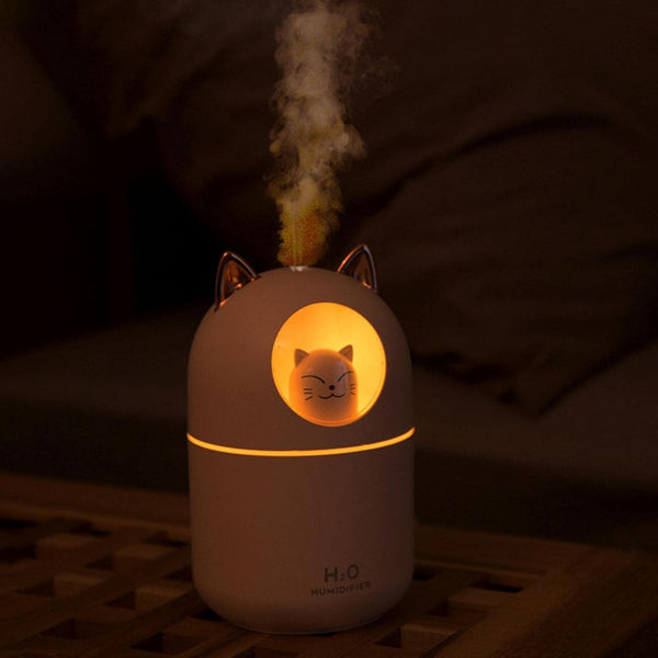 Portable USB Mini Cute Pet Cat Air Humidifier in use, emitting mist and glowing softly, ideal for small spaces.