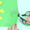 Close-up of Multi-Size Stainless Steel Professional Scissors cutting green paper for crafts.