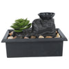 Solar Raindrop Tabletop Water Fountain with decorative plants and stones for indoor decor.