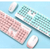 2.4 G Wireless Keyboard & Mouse Set in retro pink and blue colors on a light background.