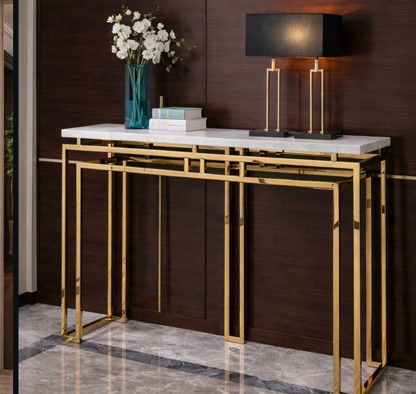 Luxury Faux Marble Gold Base Console Table displayed with decorative items in a stylish hallway setting.