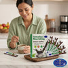 A woman enjoying a cup of coffee while using Intestines Nourishing Green Coffee Sachets for digestive support.