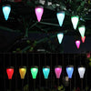 Colorful Sun Glow 6 Pack Solar Garden Light Set illuminating outdoor spaces at night.