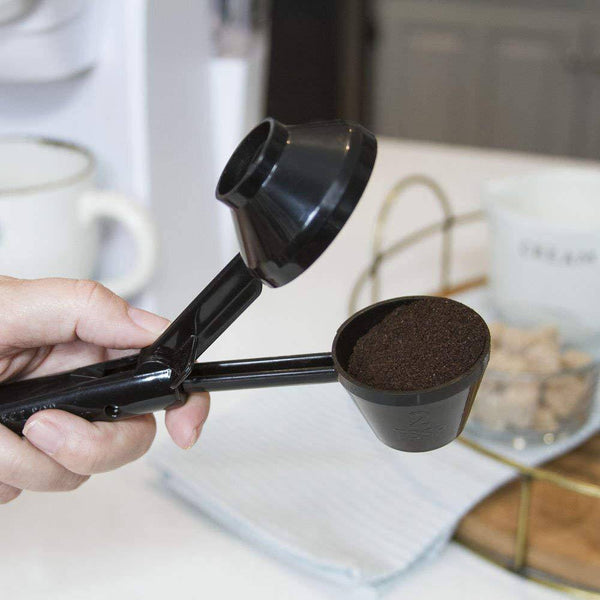 2 in 1 Coffee Scoop and Funnel being used to measure coffee grounds, showcasing its dual functionality in a kitchen setting.