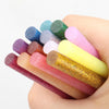 Colored Hot Glue Stick Set for DIY Crafts and Decorations in vibrant colors held in a hand.