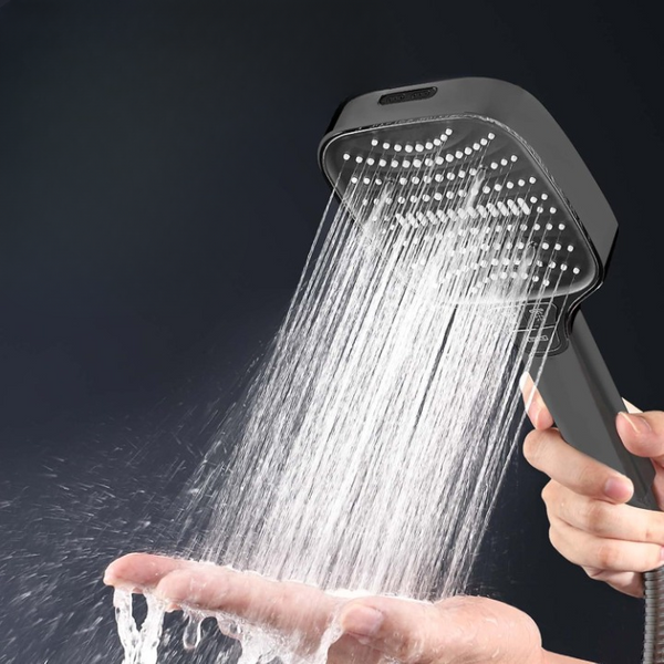 360 Degree Adjustable High-Pressure Shower Head delivering strong water flow in a hand.