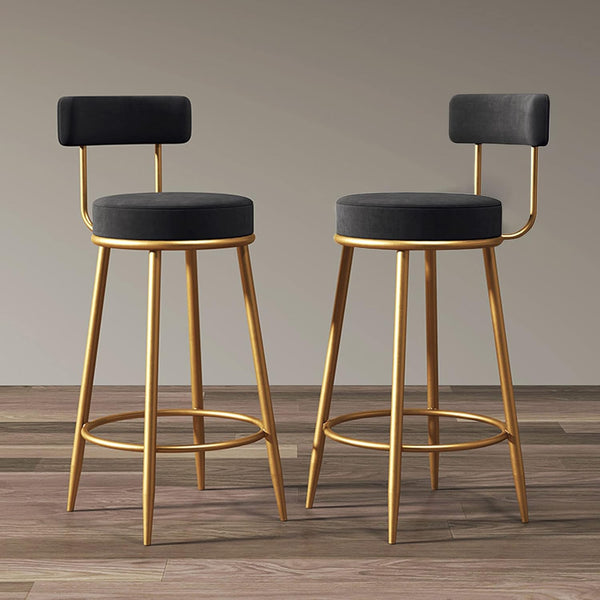 Modern Upholstered Dining Chair featuring a stylish design with a gold base and dark upholstered seats.