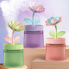 Flower Design Mini USB Air Humidifier & Aroma Diffuser in green, purple, and pink colors on wooden surface.