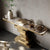 Contemporary Extra Long Faux Marble Console Table with decorative items and elegant design in a modern interior setting.