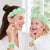 Spa Headband and Wristband Set for skincare, featuring a mother and daughter applying face cream with matching accessories.