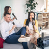Three people enjoying karaoke with 2.4G Dynamic Performance Wireless Microphone in a cozy indoor setting.
