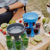 6 Shot Dispenser with multiple shot glasses and drinks on a table for easy serving at parties.