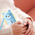 Portable 2-in-1 Electric Warmer Heater Device in use, featuring a cute bear design for personal warmth and comfort.