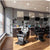 Interior of a modern salon showcasing Heavy Duty Hydraulic Barber Chairs and professional hair care products.