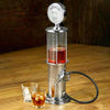 Bar Butler Liquor Pump on a wooden table with glasses of iced drinks, showcasing an elegant drink dispensing design.