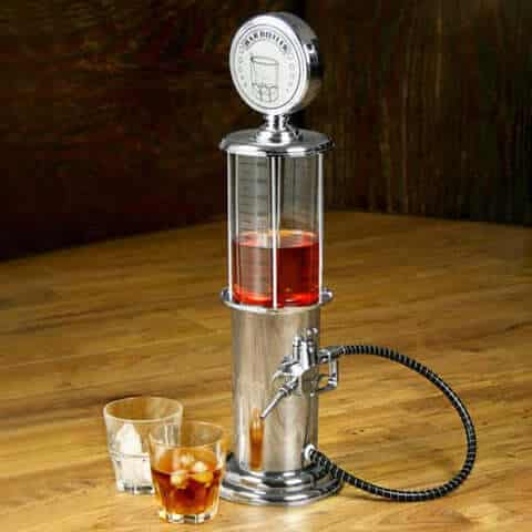Bar Butler Liquor Pump on a wooden table with glasses of iced drinks, showcasing an elegant drink dispensing design.