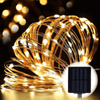 Solar-Powered LED String Lights 10M glowing warmly with solar panel, perfect for outdoor ambiance.