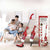 2-in-1 Mite & Dust Collector Portable Handheld Vacuum Cleaner displayed with family on a couch.