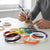 3D Pen Filament Refill in vibrant colors with a person creating an Eiffel Tower model using a 3D pen.