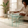 3 Piece Nesting Coffee Table Set displayed in a modern living room with a woman relaxing.