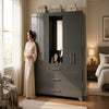 Multi-Door Bedroom Wardrobe with Built-In Central Mirror in modern bedroom setting.
