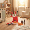 Kitchen Helper Happy Little Chef Pretend Play knife set with colorful utensils and food items in a playful kitchen setting.