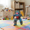 Battery-Operated Stunt Rolling Gorilla Toy performing stunts in a colorful playroom with toys and stuffed animals.