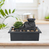 Solar Raindrop Tabletop Water Fountain with succulent plants and pebbles in a modern black container.