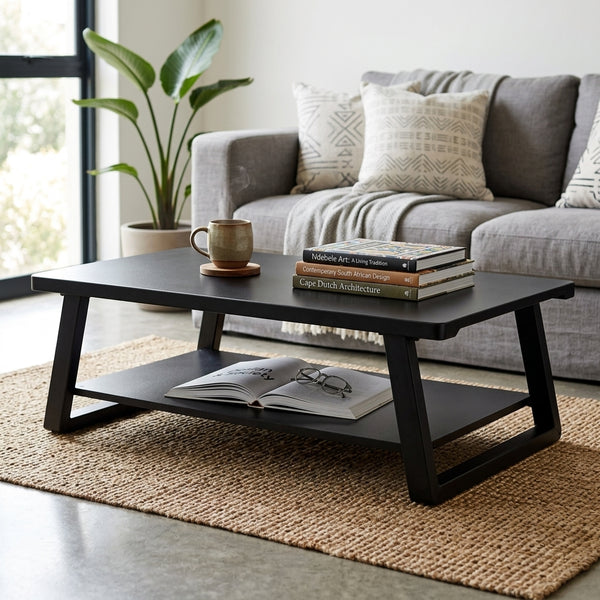 Industrial Minimalist Wood & Metal Coffee Table with books and a mug in a stylish living room setting.