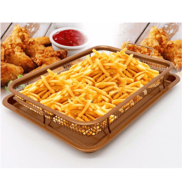 Copper Crispy Tray holding golden french fries with fried chicken and ketchup in the background.