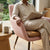 Modern Café Dining Chair in a cozy setting with a person reading a book, showcasing its stylish design and comfort.