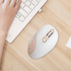Wireless Ergonomic Optical Mouse 2.4 GHz USB beside a keyboard on a wooden desk, showcasing its sleek design.