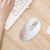 Wireless Ergonomic Optical Mouse 2.4 GHz USB beside a keyboard on a wooden desk, showcasing its sleek design.