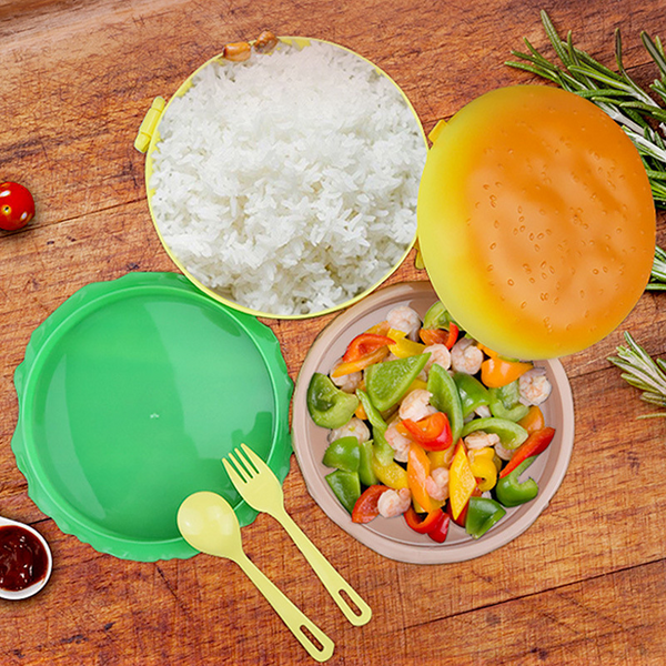 Adorable Burger-Style Double Layer Kids Lunch Box Container with rice, vegetables, and utensils on a wooden table.