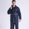 Man wearing a navy raincoat made from 210T Waterproof PU Coated Polyester Taffeta Fabric.
