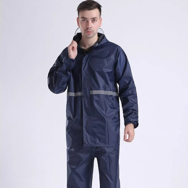 Man wearing a navy raincoat made from 210T Waterproof PU Coated Polyester Taffeta Fabric.
