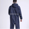 Man wearing a 210T Waterproof PU Coated Polyester Taffeta Fabric raincoat from the back.