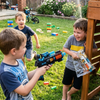 Children playing with the 33CM Electric Light and Sound Submachine Toy Gun in a backyard setting.