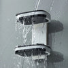 Bathroom Plastic Wall-mounted Double Layer Shelf showcasing water running over its surfaces, ideal for organizing bathroom essentials.