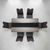 Black with Marble Lining Dining Room Table Set with modern chairs arranged around it.