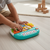 Child playing with the Cartoon Animal Electric Keyboard Early Education Toy, exploring sounds and music.