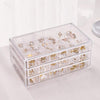 Clear Acrylic 3-Drawer 72-Compartment Jewellery Box with various rings and earrings organized inside.