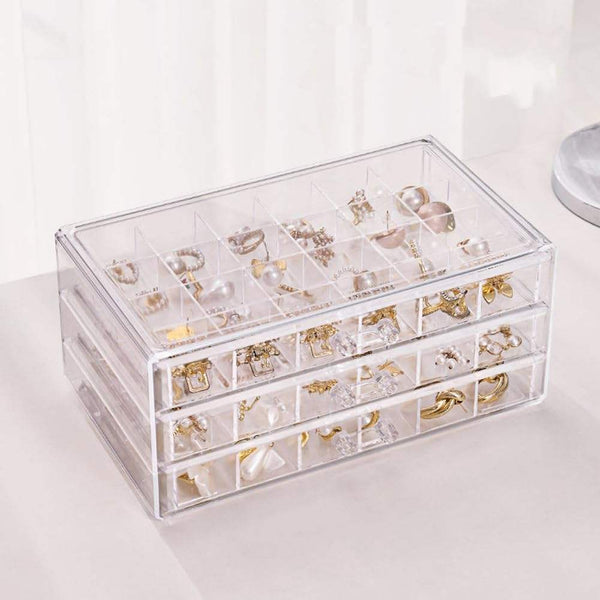 Clear Acrylic 3-Drawer 72-Compartment Jewellery Box with various rings and earrings organized inside.